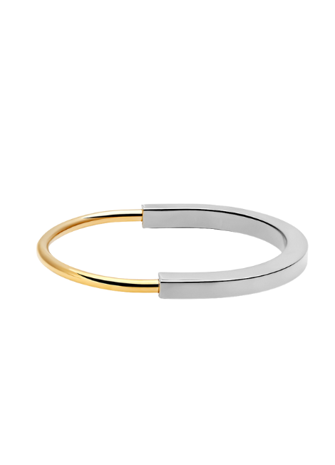 A sleek and modern statement piece, this Padlock Bangle features a two-tone finish that blends timeless elegance with a contemporary edge.