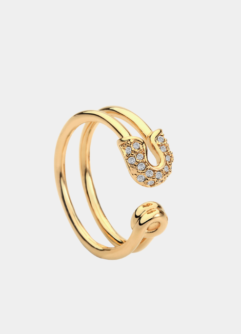 Introducing the **Tanya Safety Pin Ring**, a daring and modern piece that beautifully reimagines a classic symbol of safety and security. This unique ring represents resilience, protection, and the idea of finding beauty in the unconventional.
Crafted with attention to detail, the Tanya Safety Pin Ring features a sleek design that mimics the form of a safety pin, showcasing its edgy aesthetic while still maintaining an air of elegance. The ring serves as a reminder that even in the face of challenges, we c