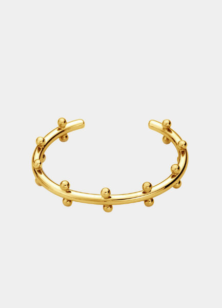 Elevate your style with the Gloria Golden Drops Bangle, crafted in 18K gold plating. A dainty yet elegant piece, perfect for both everyday wear and special occasions.