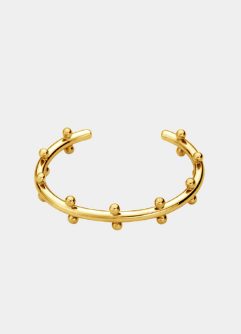 Elevate your style with the Gloria Golden Drops Bangle, crafted in 18K gold plating. A dainty yet elegant piece, perfect for both everyday wear and special occasions.