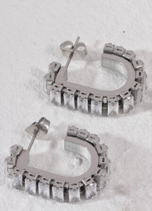 Dazzling silver-tone earrings with crystal pavé detailing, perfect for adding a touch of sparkle to any outfit.