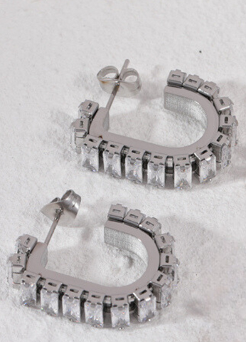 Dazzling silver-tone earrings with crystal pavé detailing, perfect for adding a touch of sparkle to any outfit.