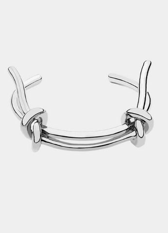 Laura Bangle in silver plating with a double lace knot design. A graceful and timeless piece that elevates everyday elegance in Hong Kong.