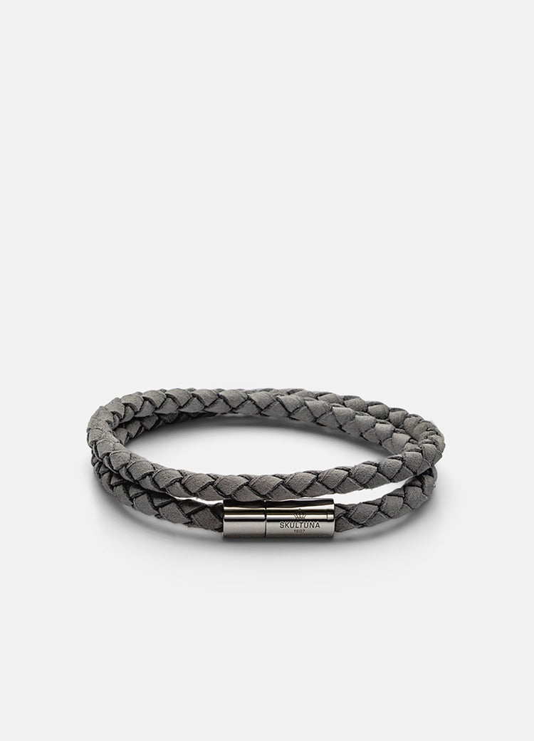 Soft grey suede bracelet with sleek silver clasp, minimalist and elegant wrap-around wrist accessory.