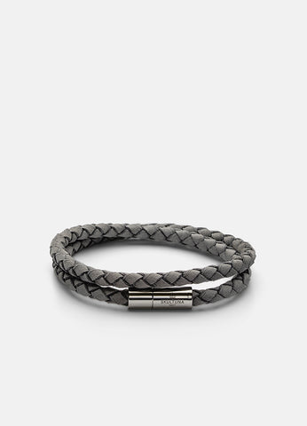 Soft grey suede bracelet with sleek silver clasp, minimalist and elegant wrap-around wrist accessory.